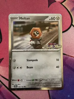 Meltan 102/142 Stellar Crown Stamp Cosmos Holo Box Promo NM English Pokemon Card - Image 1