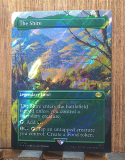 The Shire (Borderless) (Surge Foil) Universes Beyond: The Lord of the Rings:... - Image 1