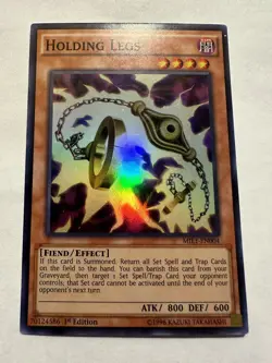 Yu-Gi-Oh! Holding Legs MIL1-EN004 Super Rare 1st Ed Lightly Played (B) - Image 1