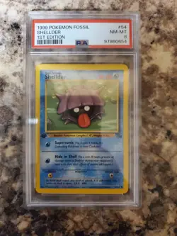 1st Edition Pokemon 1999 Fossil Shellder PSA Grade 8 - Image 1