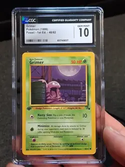 CGC 10 GEM MINT Grimer 1999 Fossil 1st Edition 48/62 Pokemon Card - Image 1