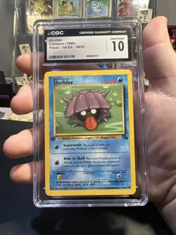 NEW CGC 10 GEM WOTC Pokemon TCG 1999 1st Edition Shellder Fossil 54/62 PSA 3026 - Image 1