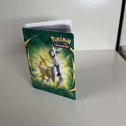Pokemon Card Lot (60) In A Mini Binder - Image 1