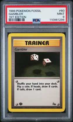 1999 POKEMON FOSSIL 1ST ED #60 GAMBLER PSA 9 - Image 1