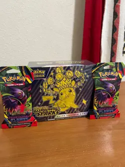 Pokemon Surging Sparks ETB SEALED + 2 Phantasmal flames sleeved booster packs - Image 1