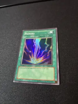 Raigeki - Misprint- LOB-053 - 1st Ed - NA Super Rare Factory Line in Holo - Image 2