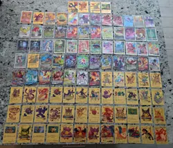 Large Pokemon lot: 100+ cards with gold metals and official V/VMAX/GX cards. - Image 1