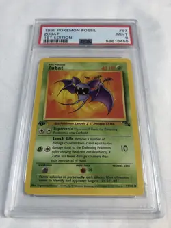 1999 POKEMON FOSSIL #57 ZUBAT 1ST EDITION MINT PSA 9 - Image 1