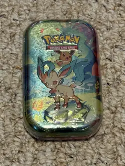 Pokemon TCG Scarlet & Violet Prismatic Evolutions Mini Tin Sealed [Leafeon] New - Image 1