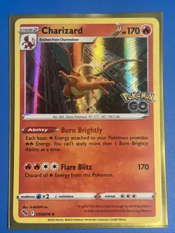 Charizard 010/078 - Pokemon GO - Holo Rare Pokemon Near Mint + Card Saver - Image 1