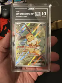 TAG 10 Eevee Black Star Promo #173 Pokemon Prismatic Evolutions ENGLISH GEM MINT - Image 1