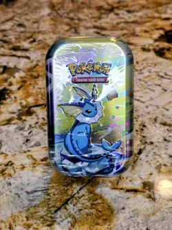 Pokemon TCG - Prismatic Evolutions Mini Tin (Vaporeon) Factory Sealed - Image 1