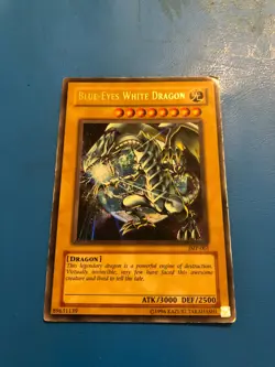 YUGIOH Ultra Rare Blue-Eyes White Dragon JMP-001 PLAYED - Image 1
