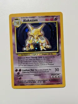 1999-2000 WOTC Pokemon Base Set 2 Alakazam 1/130 Holo Card (NM) - Image 1