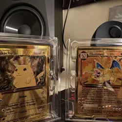Pokemon Celebrations Gold Metal Charizard & Pikachu cards - Image 1