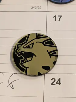 Pokemon Tyranitar Mini Gold Plastic Coin Pokemon TCG - Image 1