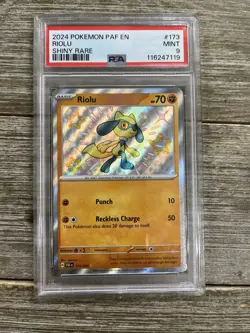 Graded PSA 9 2024 Pokemon PAF EN Riolu Shiny Rare #173 - Image 1
