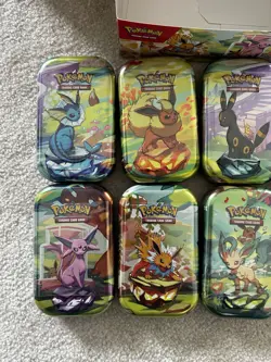Pokemon Prismatic Evolutions Mini Tin Display Box Full Set 8 Tins Seals Tins - Image 3