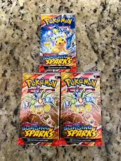 Pokemon Surging Sparks - 11 Factory Sealed Booster Pack Bundle - English - Image 1