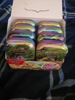 Pokemon Prismatic Evolutions Mini Tin Empty Set Of 8 (Tin + Card + Coin + Box) - Image 1