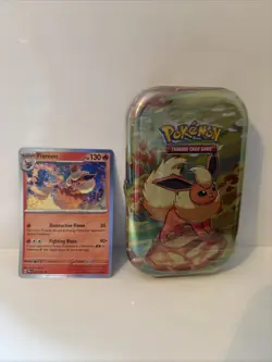 Pokemon Prismatic Evolutions Flareon Mini Tin Sealed W/ Flareon Cosmos holo card - Image 1