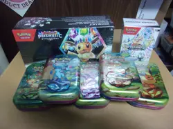 POKEMON PRISMATIC EVOLUTIONS BUNDLE BOX + SURPRISE BOX + (5) MINI TINS - Image 1