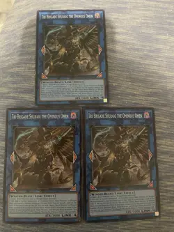 3x tri-brigade shuraig the ominous omen Op29! Near Mint Condition - Image 1