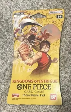 One Piece KINGDOMS OF INTRIGUE English Sleeved Booster OP-04 Sealed 12-Card Pack - Image 1