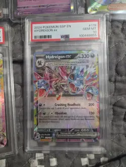 2024 Pokemon TCG Hydreigon ex 119/191 Sv08: Surging Sparks Holo PSA 10 - Image 1