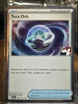 Play! Pokemon Prize Pack Series 7 Surging Sparks Cosmo Holo 189/191 Tera Orb - Image 1