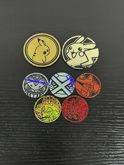 Lot of 7 Pokemon Coins Pikachu Metagross Lycanroc Yveltal Volcanion Genesect - Image 1