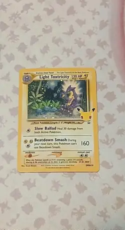 Light Toxtricity SWSH137 Black Star Promo Card Celebrations 25th Anny - Image 1