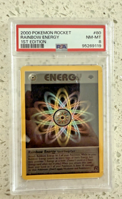 2000 1st Edition Pokemon Card Rocket Rainbow Energy MINT PSA 8 Graded WOTC - Image 1