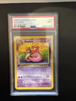 1999 POKEMON FOSSIL 1ST EDITION #43 SLOWBRO PSA 9 - Image 1