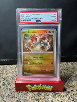 PSA 9 Groudon Poke Ball Pattern #49 Pokemon Prismatic Evolutions Reverse Holo - Image 1