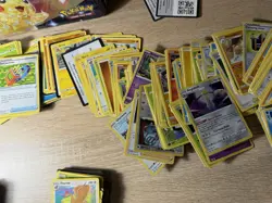 Pokemon Cards In A Pokemon TCG Surging Sparks Collector's Lunch Box Tin - Image 4