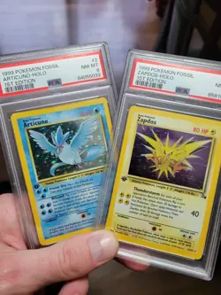 PSA 8 1st Edition Zapdos 15/62 Articuno 2/62 Fossil Pokemon WOTC - Image 1