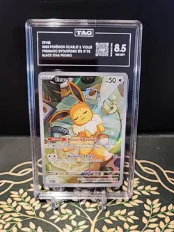 2025 Pokemon Prismatic Evolutions SVP 173 Eevee Promo TAG 8.5 - Image 1