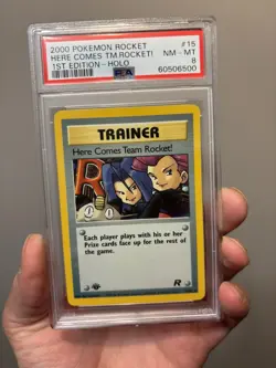 2000 Pokemon Team Rocket 1st Edition Here Comes Team Rocket Holo 15/82 PSA 8 - Image 1