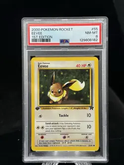 Eevee #55 1st Edition Team Rocket 2000 Pokemon PSA 8 ? - Image 1