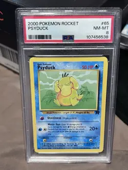 2000 Pokemon Rocket 🚀 Psyduck #65 NM-MT PSA 8 - Image 1