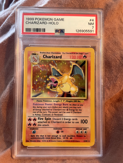1999 Pokemon Charizard Holo Base Set Unlimited PSA 7 Near Mint 4/102 - Image 1
