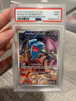 2025 POKEMON DESTINED RIVALS POKEMON CENTER #203 TEAM ROCKET'S WOBBUFFET PSA 9 - Image 1