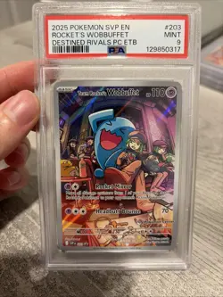 2025 POKEMON DESTINED RIVALS POKEMON CENTER #203 TEAM ROCKET'S WOBBUFFET PSA 9 - Image 1