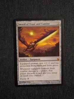 Sword of Feast and Famine Mirrodin Besieged Lightly Played - Image 1