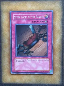Yugioh Seven Tools of the Bandit DB2-EN075 Super Rare LP - Image 1