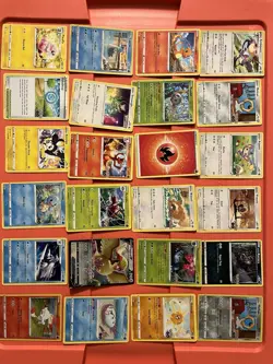 63 Pack Pokemon playing Cards with large gold-colored Pikachu TCG coin - Image 1