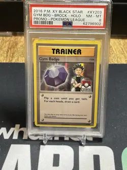 2013-17 Pokemon Promo Gym Badge Brock Holo Pokemon League Stamp #XY203 PSA 8 NM - Image 1