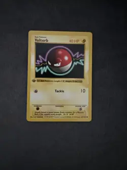 Pokemon Voltorb 67/102 1st Edition Shadowless Base Set Card - Image 1