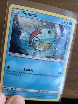 2019 Squirtle 33/214 NM Cosmos Holo Promo Unbroken Bonds Pokemon Card - Image 1
